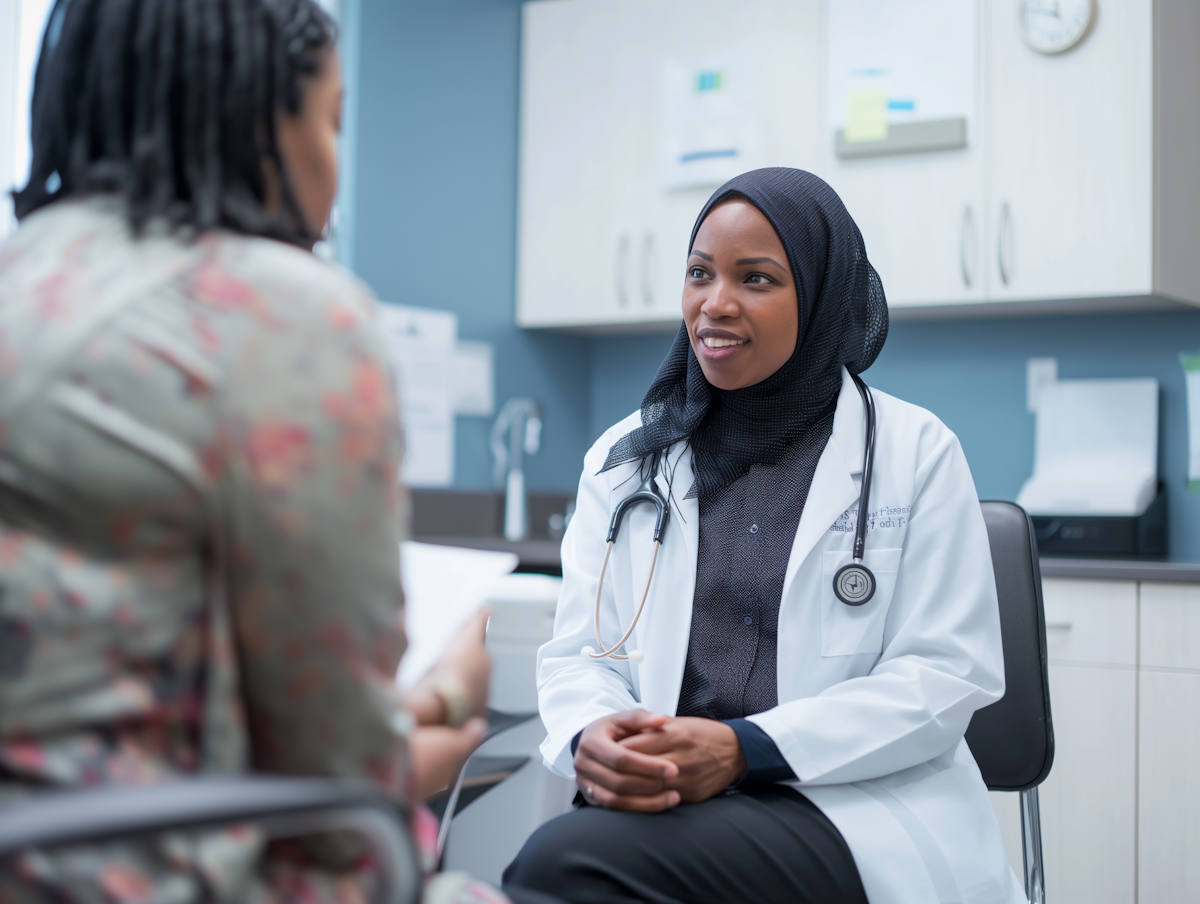Doctor speaking with patient in consulting room